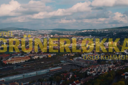 Et flyfoto av en by med ordene grunerløkka over seg.